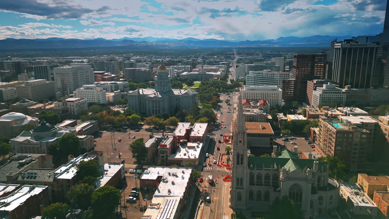 Denver, USA, 28 July 2025: Vast cityscape of Denver, Colorado, USA on sunny day. View on Cathedral Basilica and Colorado State Capitol. Aerial perspective