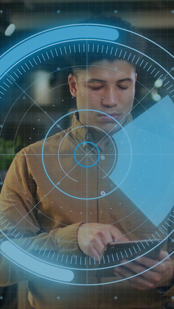 Vertical video: Man tapping tablet reading blue paper in business activating HUD and ending review