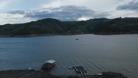 Aerial-Lake-Calima-at-Sunset-Close-to-Ground