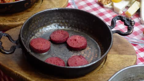 turkish sausage in a copper pan