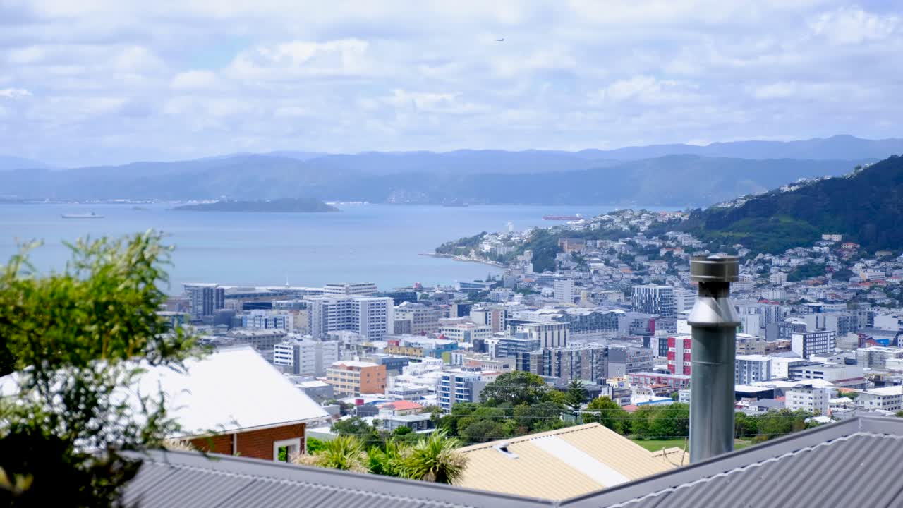 Aerial cityscape view of densely packed buildings and harbour ocean in capital city of Wellington, New Zealand Aotearoa
