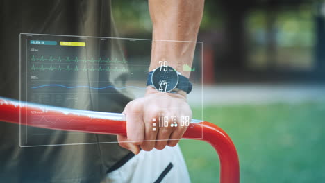 digital display shows training data of an athletic man doing push-ups on a training device in the background