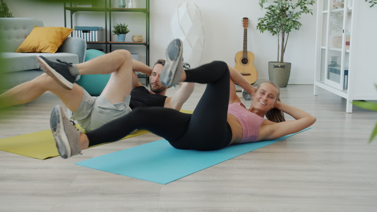 Couple Doing Crunches at Home