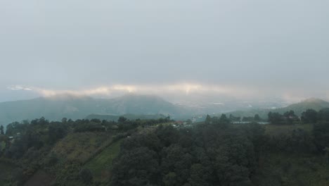 Flying-next-to-the-top-of-the-mountains-during-a-cloudy-cold-weather-in-Guatemala---Drone-aerial-landscape-view