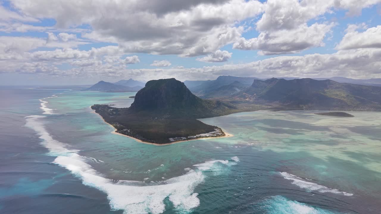 Wide aerial shot of the famous underwater waterfall illusion in Mauritius