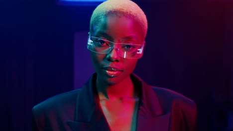 a woman in futuristic glasses under neon lights