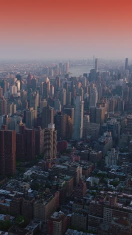 impressive new york cityscape at sunrise. beautiful quarters and streets of a metropolis. pink sky backdrop. vertical video