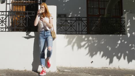 young woman standing in a city street