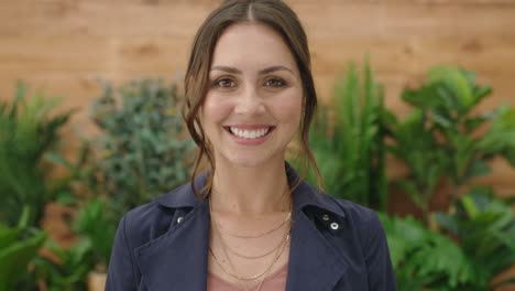 portrait of young beautiful caucasian woman smiling happy at camera in garden background