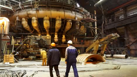 steel mill workers inspecting equipment