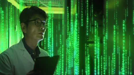 Animation-of-binary-coding-over-asian-male-worker-in-server-room