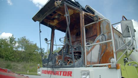 Burnt-out-Combine-Harvester-In-The-Field---close-up