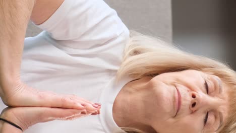 Portrait of an Elderly Fairhaired Woman Doing Yoga Meditation Portrait of an Elderly Fairhaired Woman Doing Yoga Meditation in Harmony with yourself