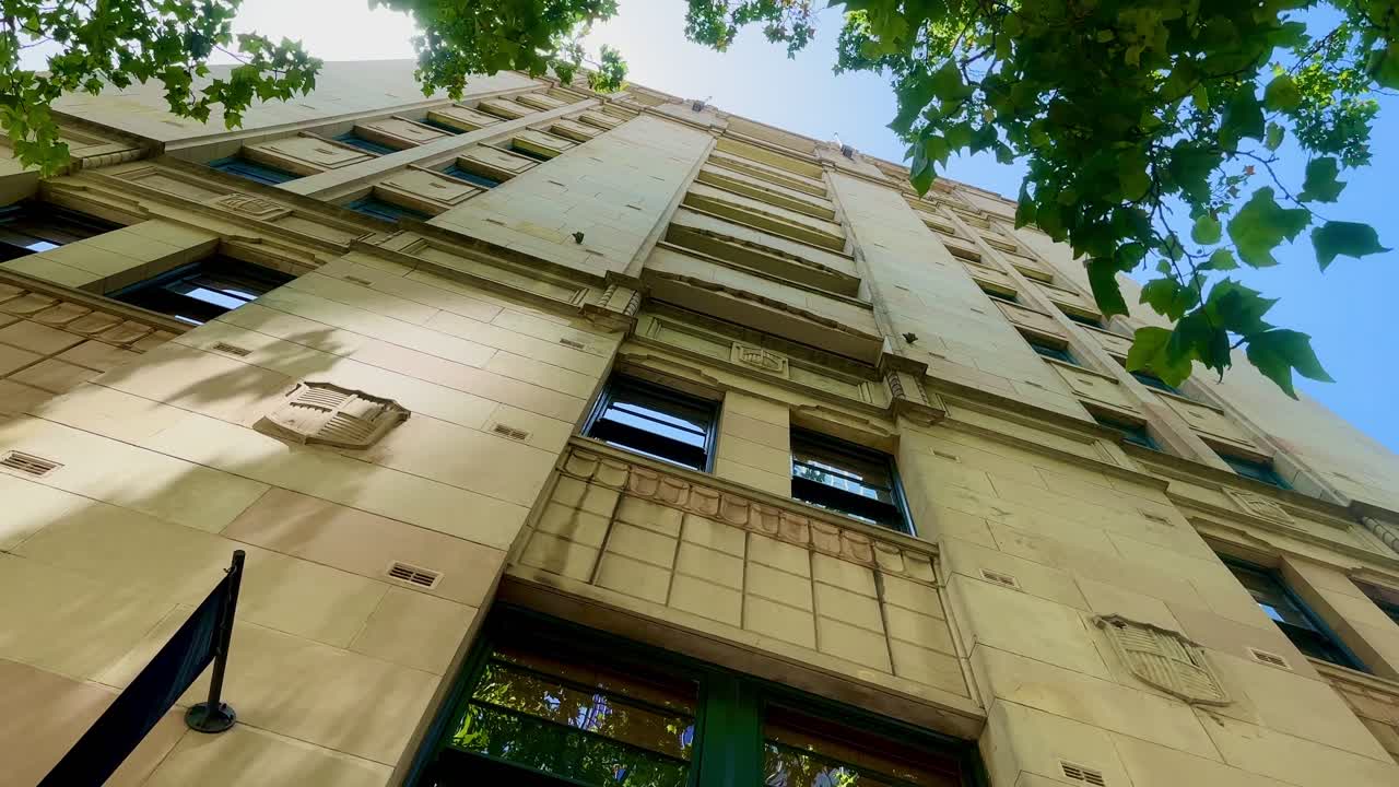 Gothic New York style architecture limestone apartment oblique low angle bluesky
