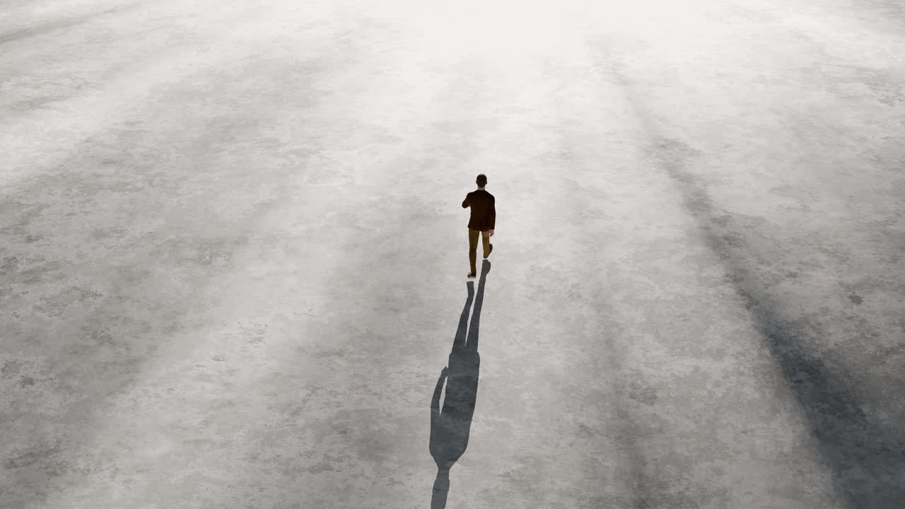 Man Walking Across Vast Empty Concrete Ground with Long Shadow