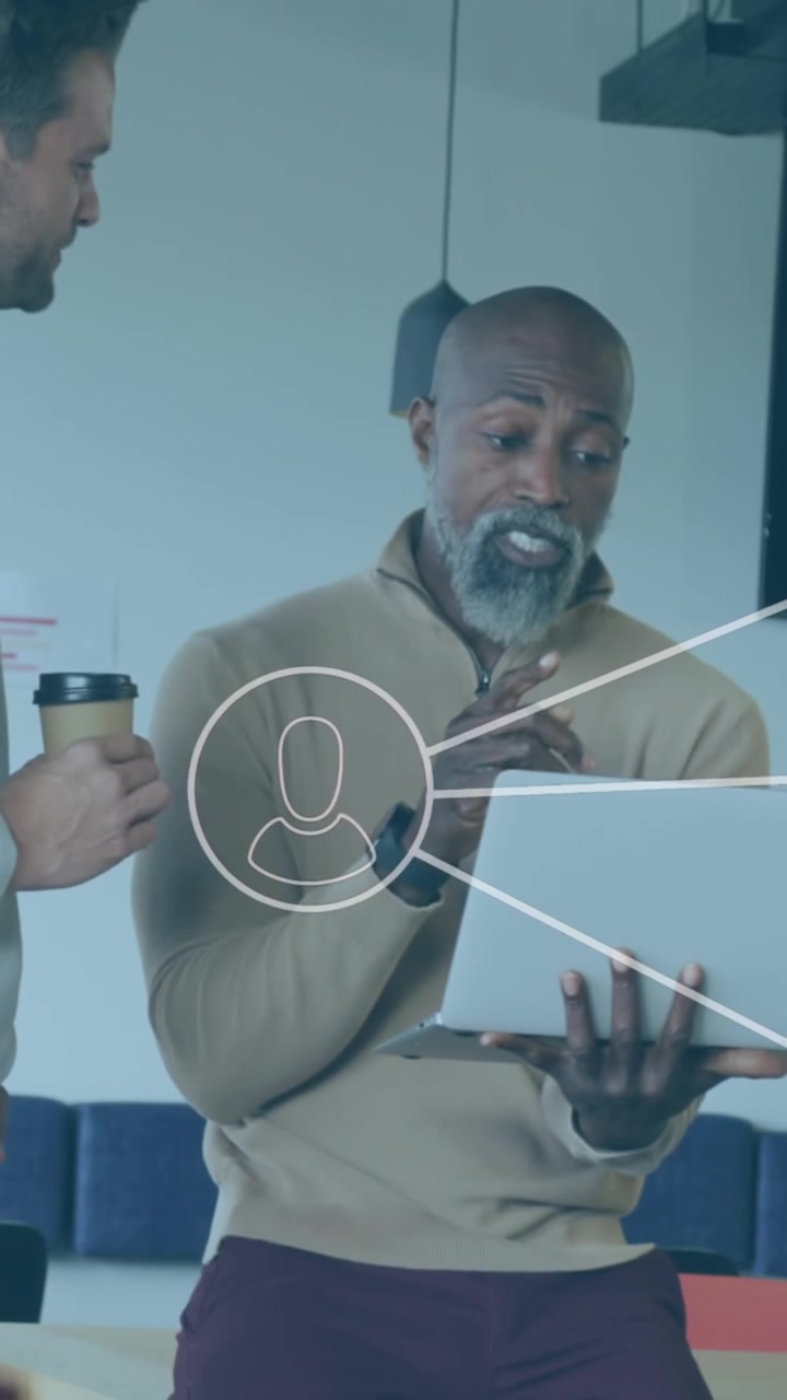 Animation of network of profile icons over three diverse men discussing over a laptop at office