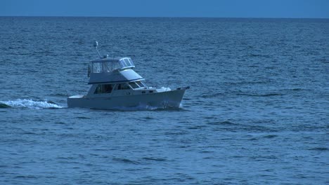 boat-passing-through-busy-harbor