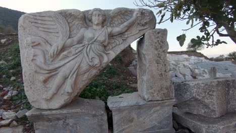 stone carving of the goddess nike, ephesus ancient city, turkey