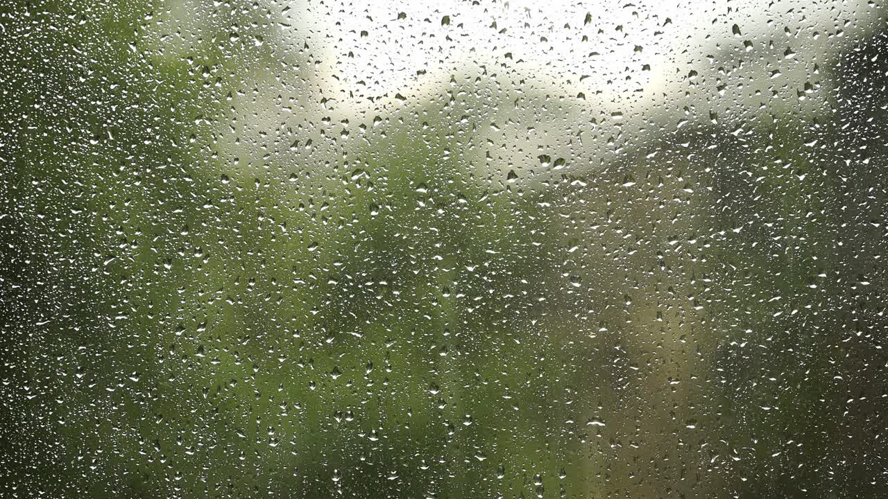 Raindrops on a window in the summer