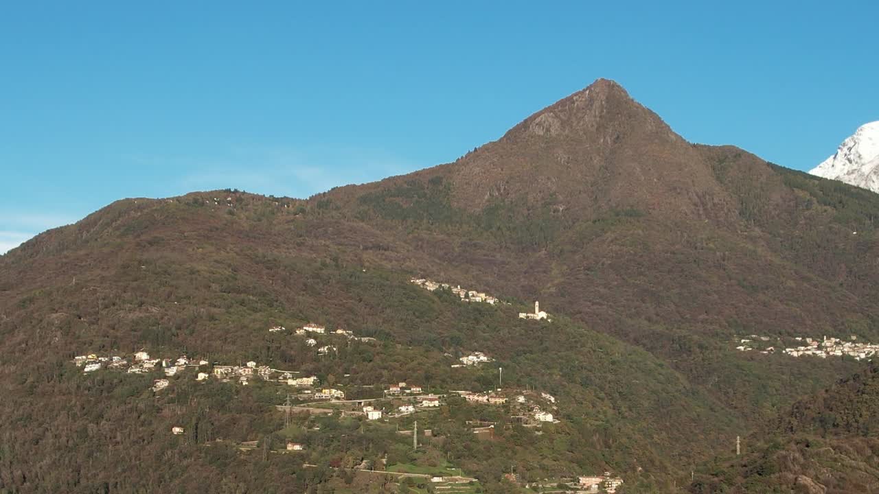 Breathtaking aerial view of the Alps highlighting tranquil Italian village