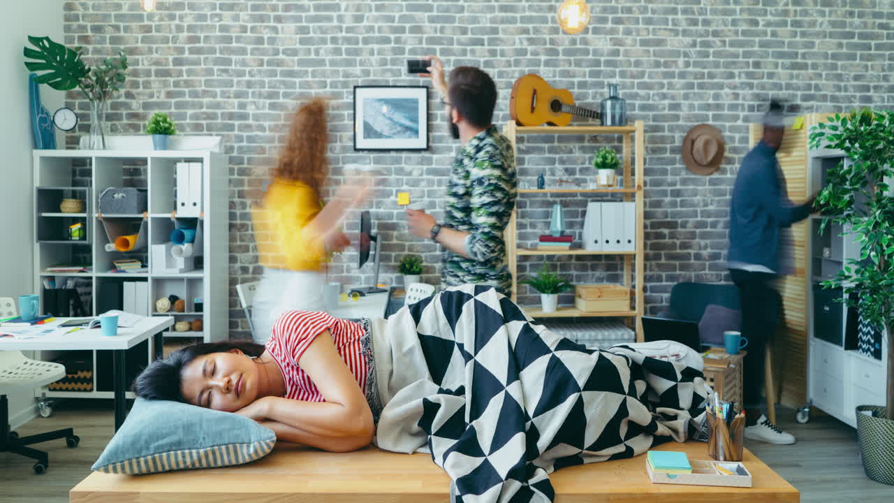 Woman Taking a Nap in a Modern Office