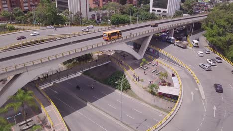 Ascending-fast-aerial-4k-shot-of-Envigado-and-Aguacatala-roundabout-in-Medellin,-Colombia