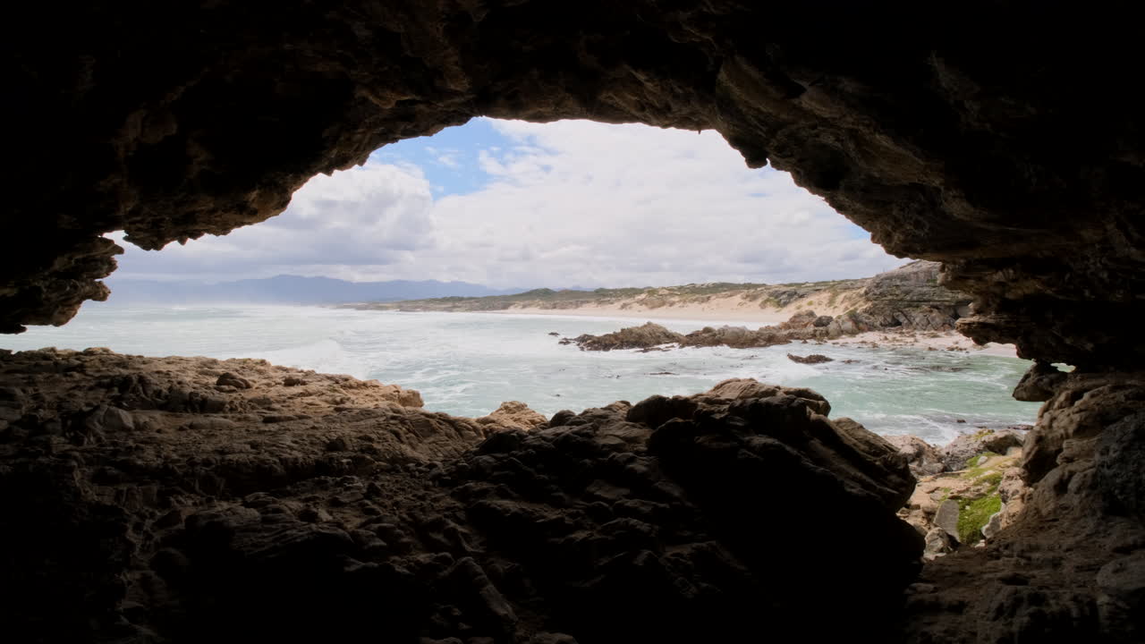 View from within historic Klipgat Cave overlooking pristine Walker Bay coastline