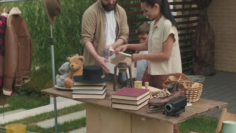 family organizing garage sale
