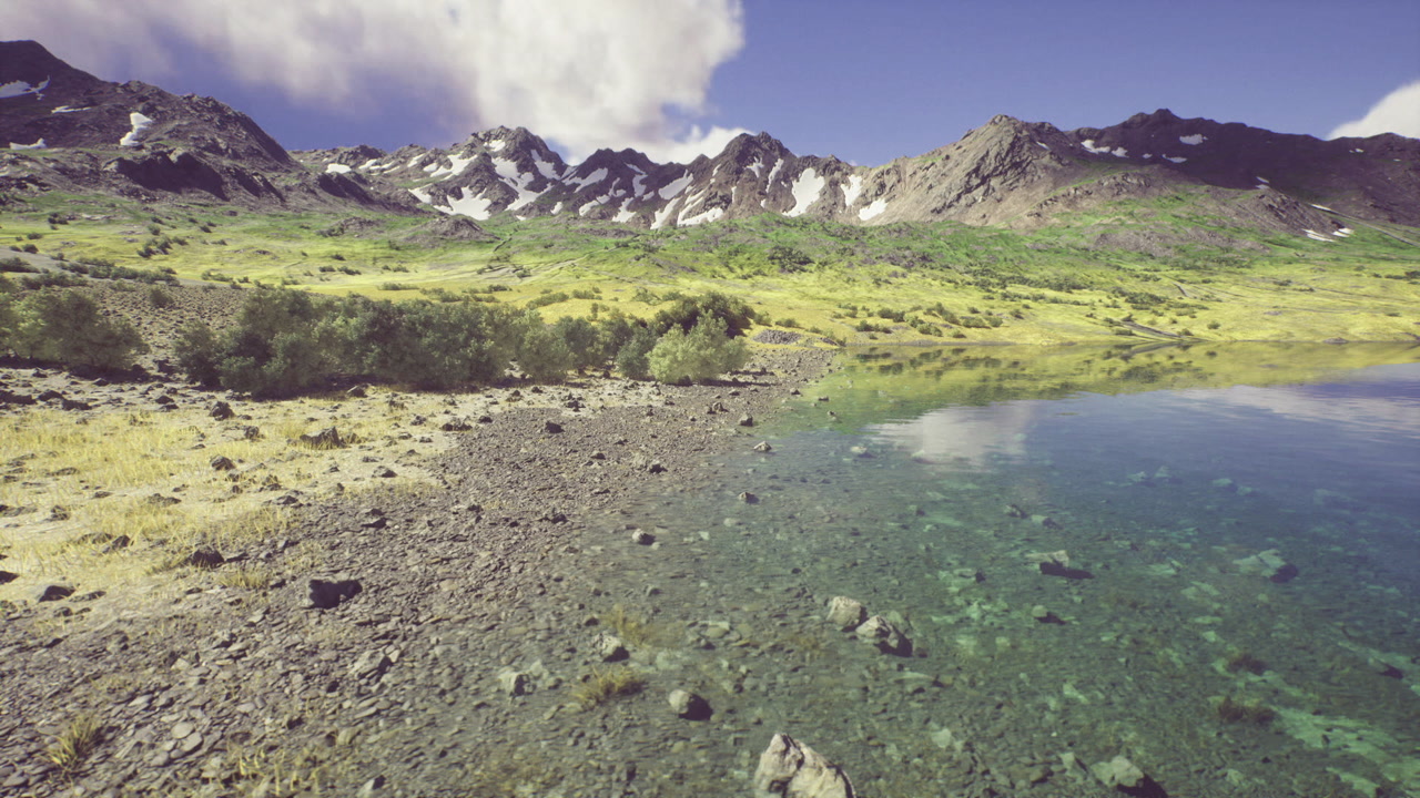 Tranquil alpine landscape featuring shimmering water and snow caps