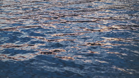 rippled water surface at sunset