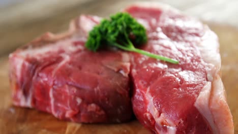 raw steak garnished with herb