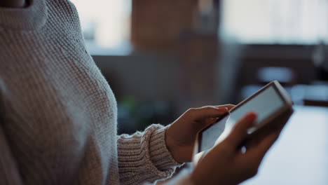 close up of womans hands using digital tablet computer technology