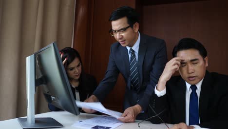 boss at the meeting getting stressed his employee in the office