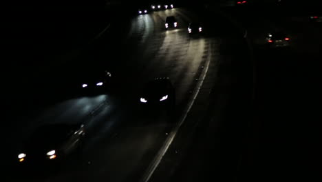 erratic movement shot of cars on the freeway at night