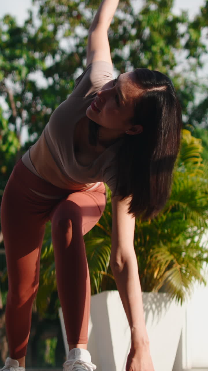 Woman practicing yoga outdoors