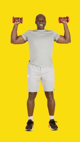 african man doing vertical pectoral contraction exercises with dumbbells