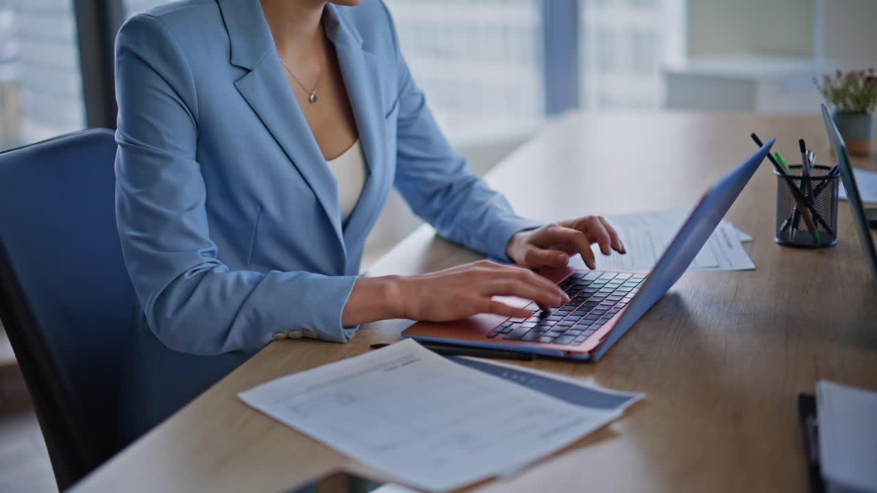 Manager hands typing keyboard laptop sitting cabinet closeup. Blonde working