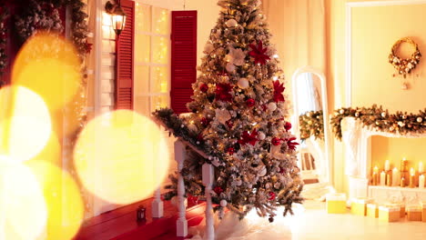 amazingly decorated christmas tree near the festive porch. beautiful ornaments for the holiday footage in studio.