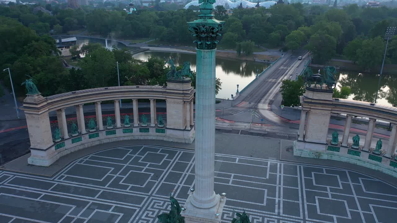 Drone footage of the empty Heroe's Square in Budapest, Hungary at the time of the Covid virus. Early morning at the sunrise in spring.