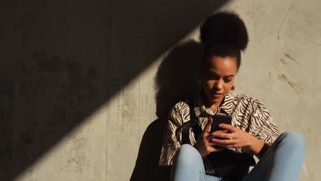 Front-view-of-mixed-race-woman-on-smartphone