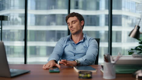 tired manager working thinking closeup. exhausted employee solving problems