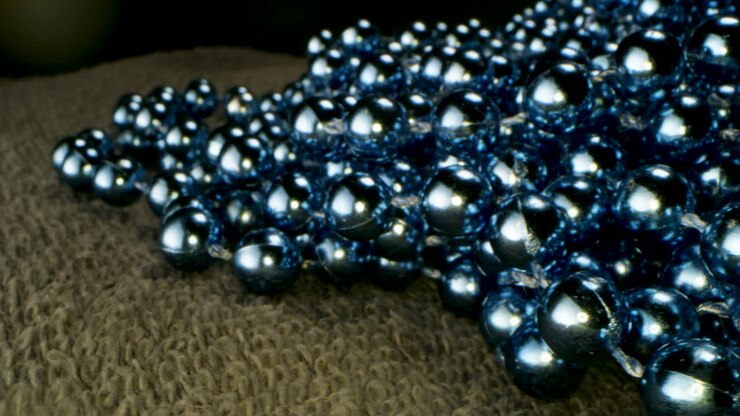 Close-up of a cluster of blue metallic beads