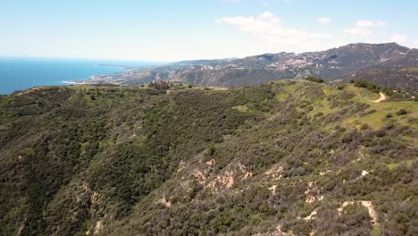 4K-drone-shot-of-Malibu-Skyline-and-Pacific-Ocean-on-top-of-the-Santa-Monica-Mountains-on-a-sunny-day