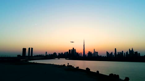 aerial view of drone filming dubai cityscape during scenic sunset, u.a.e.