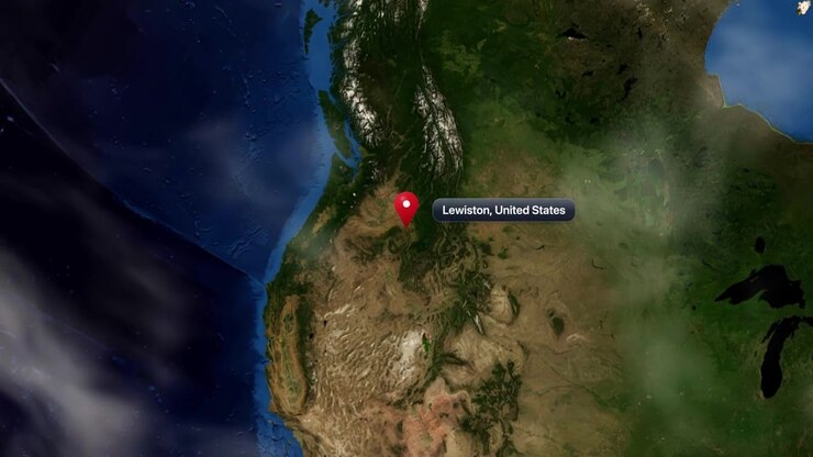 Satellite camera zooms from deep space orbit into Lewiston, United States, marked by pin. Includes NASA public domain imagery.