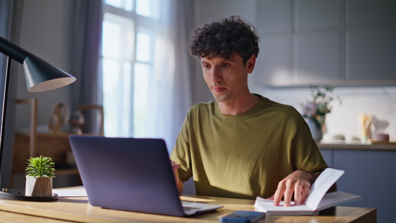 Guy freelancer talking virtual meeting looking laptop camera workplace closeup