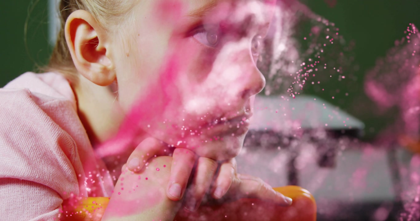 Kid on orange bar as pink particles appearing swirling receding over face revealing thought in tech