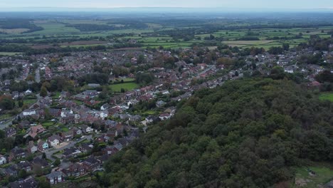 Aerial-view-above-Halton-North-England-coastal-countryside-town-estate-green-space-slow-dolly-left