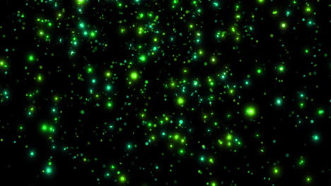 animación de manchas verdes brillantes que caen sobre un fondo negro