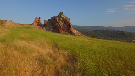 aerial: a rock on top of a hill on lesbos island, greece